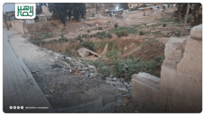 جدار متهدم على جسر عفرين يهدد حياة المارة